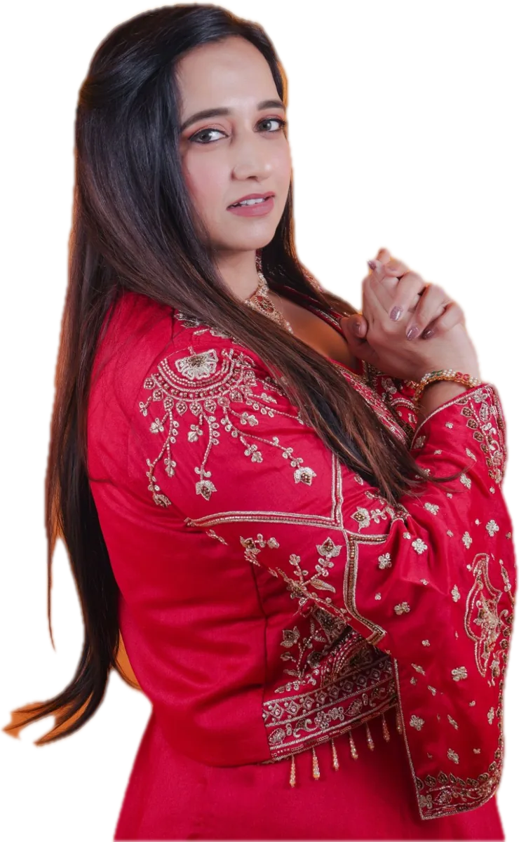 Diimple Pancholi smiling in a red embroidered outfit